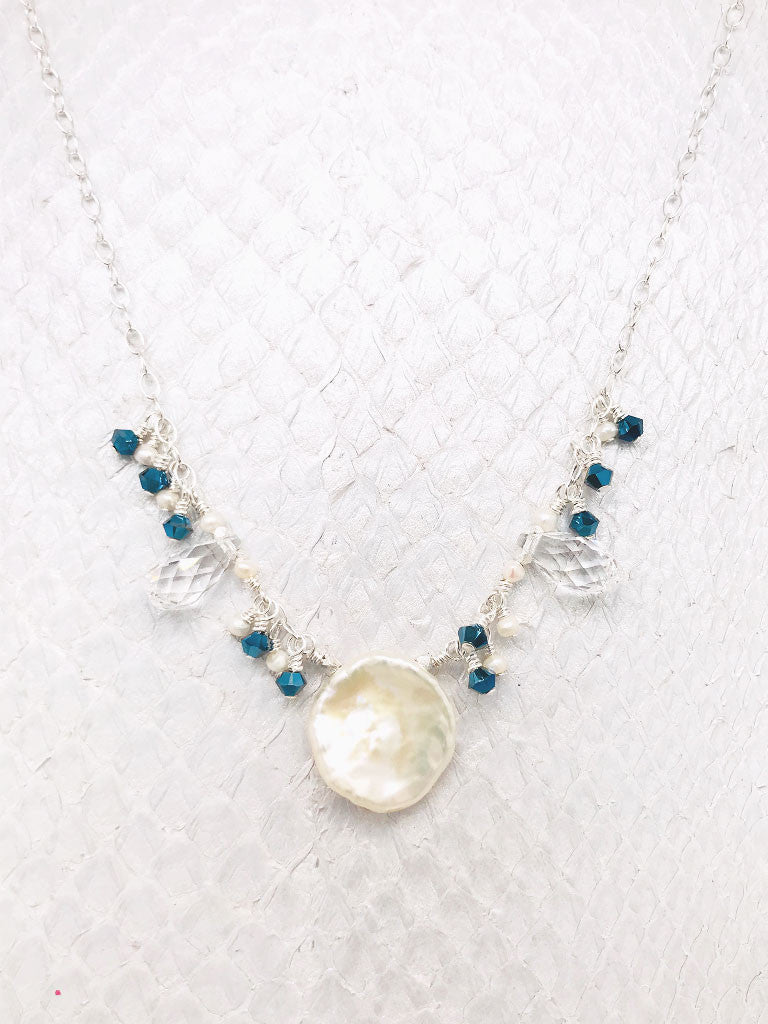 Martinique Necklace- A Keshi Pearl pendant with mesmerizing Emerald Swarovski crystals and Freshwater Pearls on Sterling Silver adjustable chain.