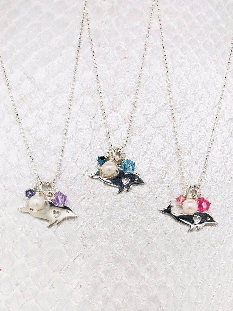 Nantucket Necklace-Sterling Silver Dolphin Charm adorned with Freshwater pearls and Swarovski Crystals suspended by Sterling Silver ball chain handcrafted by the Chesapeake bay in Cape charles, VA.