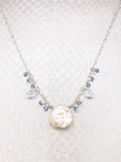 Light Sapphire Swarovski Crystals and Freshwater Pearls surrounding a White Keshi Pearl 