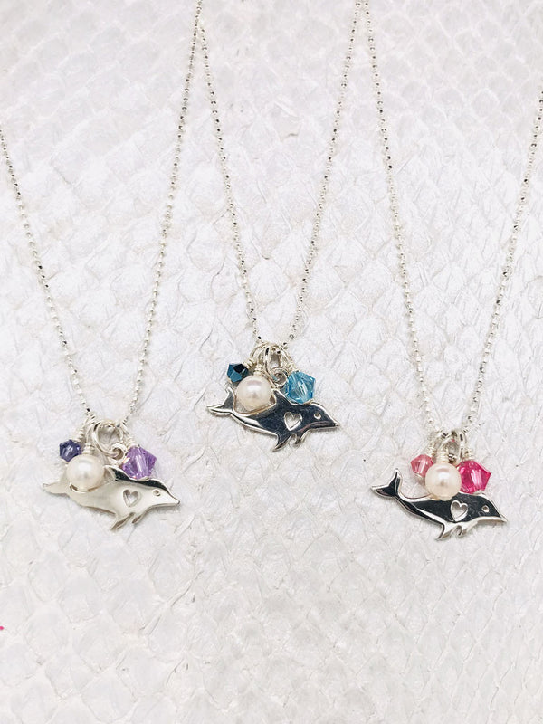 Nantucket Necklace-Sterling Silver Dolphin Charm adorned with Freshwater pearls and Swarovski Crystals suspended by Sterling Silver ball chain handcrafted by the Chesapeake bay in Cape charles, VA.