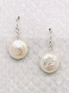 Barcelona Earrings– 1/2" White Freshwater Coin Pearl suspended from Sterling Silver ear wires handcrafted in Cape Charles, VA.