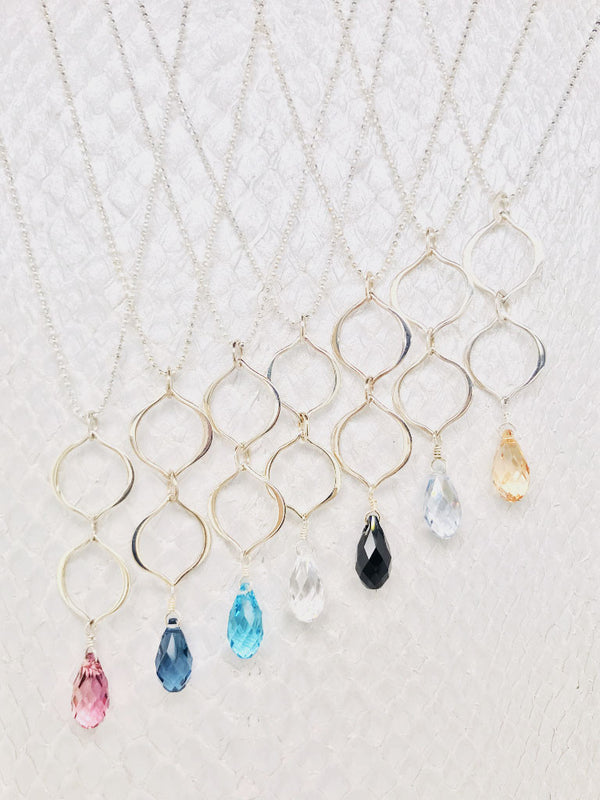 3/4" Swarovski Crystal suspended by two sterling silver petal shaped links on an adjustable 16"-19" Sterling Silver ball chain handcrafted in Cape Charles, VA.